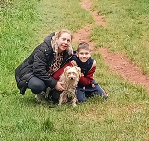 Mother and son Guardians with homeowners pet