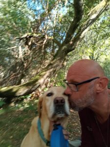 Nathan with a dog during a house and pet sit